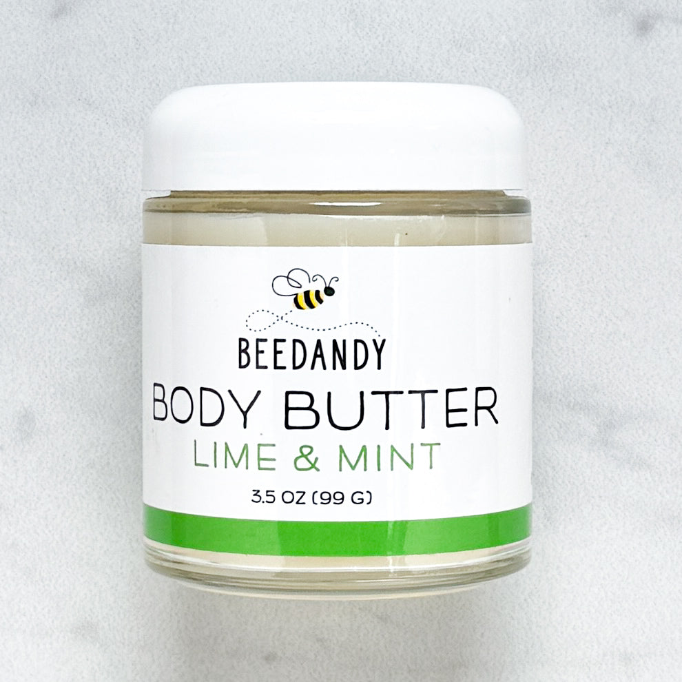 Beedandy Lime Mint Body Butter in a small clear glass jar with a white lid, shown on a light gray background. The label features a bee logo and reads “Body Butter, Lime Mint, 3.5 oz (99 g),” with a green accent band at the bottom.