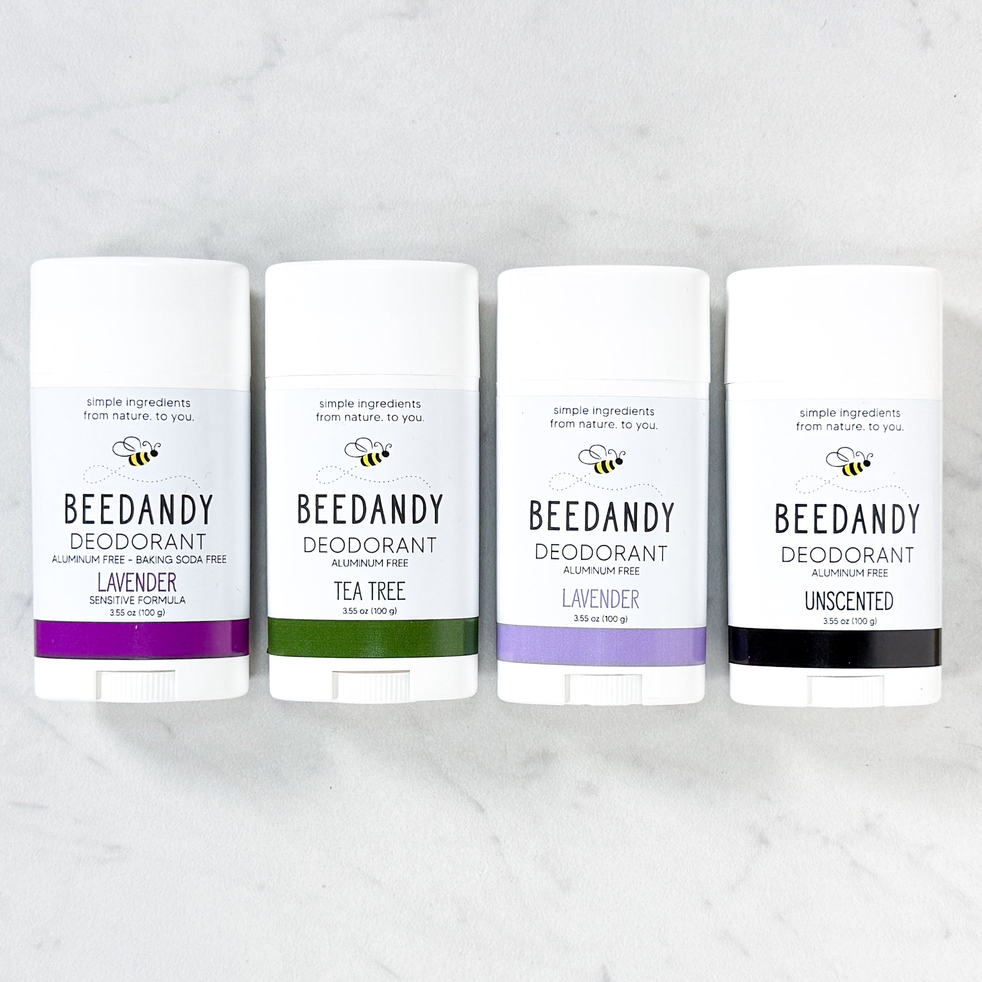Beedandy aluminum-free deodorant sticks in assorted scents displayed on a light background.