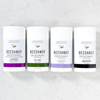 Beedandy aluminum-free deodorant sticks in assorted scents displayed on a light background.