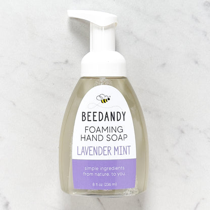 Beedandy lavender mint foaming hand soap in a clear pump bottle with white dispenser on a light background.