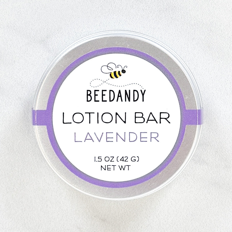 A metal tin of BEEDANDY lavender lotion bar on a white background.