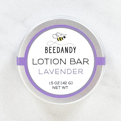 A metal tin of BEEDANDY lavender lotion bar on a white background.