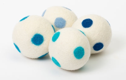 set of 4 white dryer balls with blue dots, on white background