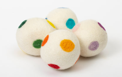 set of 4 white dryer balls with multi colored dots, on white background