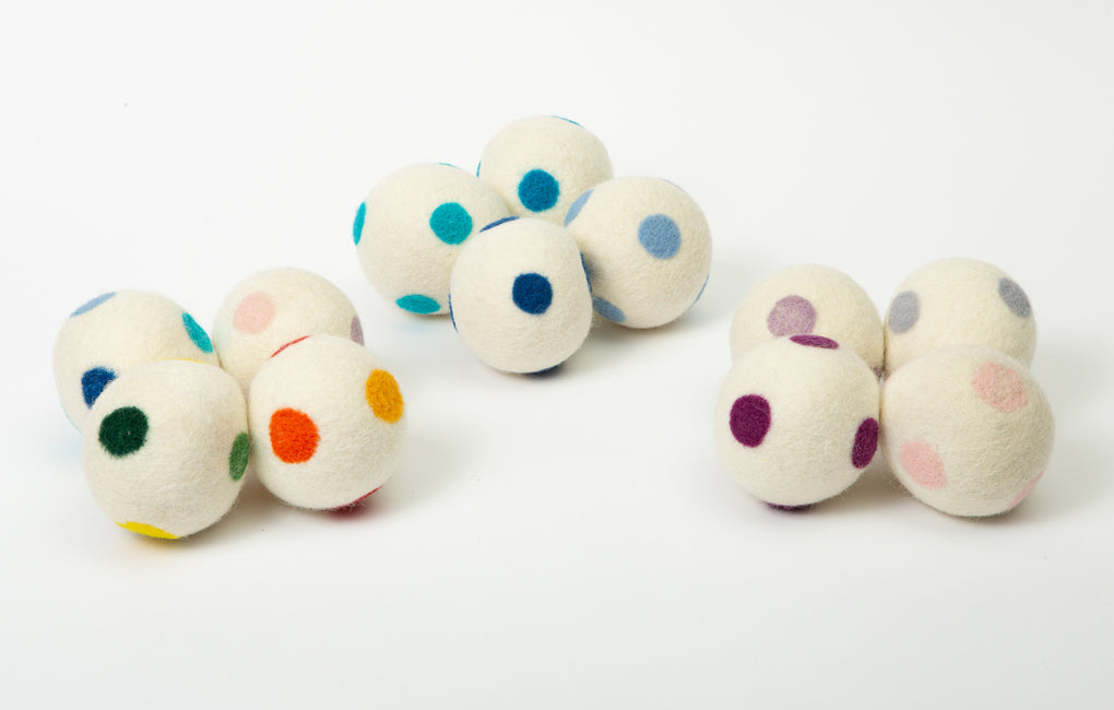 3 groups of wool dryer balls with multicolored felt dots on a white background.