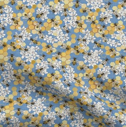 blue fabric with bee and honeycomb print